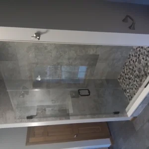 Master shower with glass doors and porcelain tile in Elverson, PA