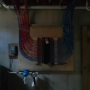 Organized PEX plumbing manifold in the basement in Elverson, PA