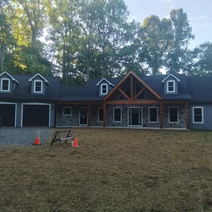 Front exterior of custom rancher with two-car garage in Elverson, PA