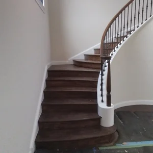 Custom oak spiral staircase in a grand foyer entrance in Newtown Square, PA