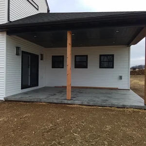 Custom Farmhouse concrete patio with roof 