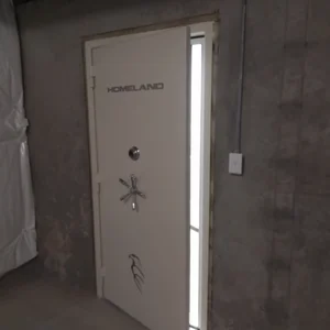 A secure firearms vault with the door partially open