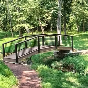 TimberTech composite decking and black aluminum railing on the footbridge in Malvern, PA