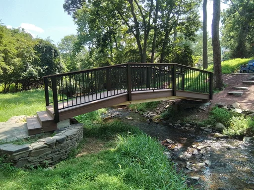Raised composite footbridge over a flood-prone creek in Malvern, PA