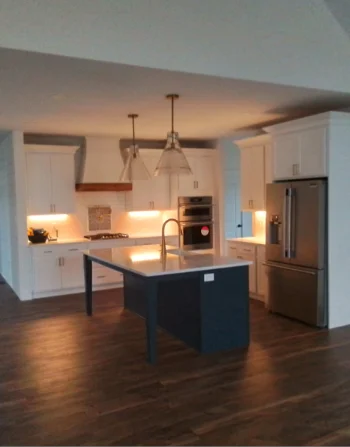 A finished modern kitchen remodeling project with white cabinets and countertops Concordville, PA