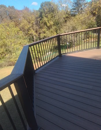 Custom composite deck corner and railing detail in Compass, PA — Sunny Ridge Construction