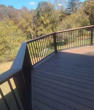 A composite deck designed to blend with the lush wooded landscape in Exton, PA