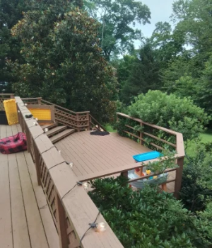 A multi-level custom wood deck in a wooded residential property in Malvern, PA