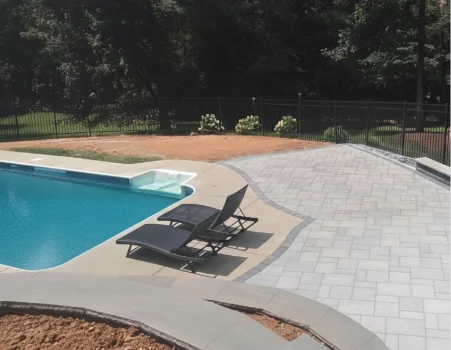 A recently hardscaped yard with a wooden bridge in Chester County, PA