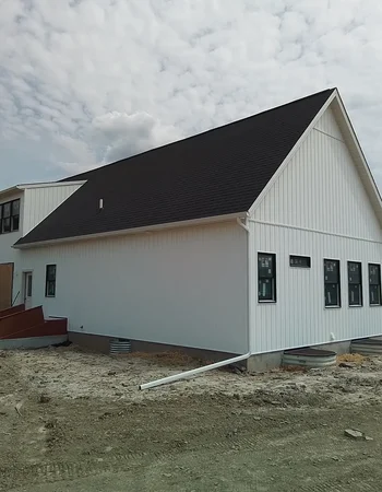 Newly sided home with asphalt shingle roofing in Coatesville, PA — Sunny Ridge Construction