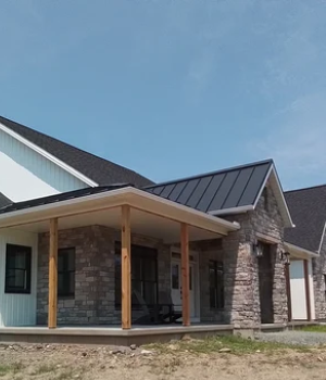 Newly constructed home with metal roofing and stone siding in Downingtown, PA